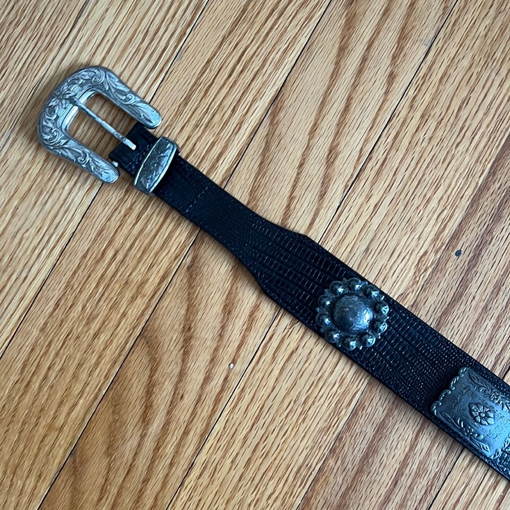 Black leather belt with silver buckle